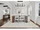 Elegant dining room with wood table, chandelier, and neutral decor at 17718 Snug Harbor Rd, Charlotte, NC 28278