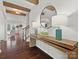 Bright entryway with wood console table, mirror, and hardwood floors at 17718 Snug Harbor Rd, Charlotte, NC 28278