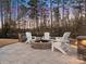 Evening view of a fire pit with seating area at 17718 Snug Harbor Rd, Charlotte, NC 28278