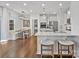 Modern kitchen with white cabinets, island, and breakfast nook at 17718 Snug Harbor Rd, Charlotte, NC 28278