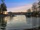 Boats docked at sunset on calm lake water at 17718 Snug Harbor Rd, Charlotte, NC 28278