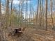 Wooden table and chairs overlooking a lake at 17718 Snug Harbor Rd, Charlotte, NC 28278