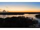 Scenic sunset view over tranquil lake waters at 17718 Snug Harbor Rd, Charlotte, NC 28278