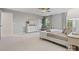 Main bedroom with a large bed, window, and neutral color palette at 17718 Snug Harbor Rd, Charlotte, NC 28278