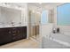 Modern bathroom with double vanity, soaking tub and walk-in shower at 236 Ascot Run Way, Fort Mill, SC 29715