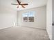 Bright bedroom featuring carpet and large window at 236 Ascot Run Way, Fort Mill, SC 29715