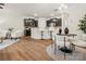 Kitchen breakfast bar and dining area with hardwood floors at 236 Ascot Run Way, Fort Mill, SC 29715