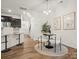 Bright dining area with modern light fixture and seating for four at 236 Ascot Run Way, Fort Mill, SC 29715