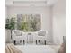 Relaxing sitting area in main bedroom with two armchairs and natural light at 236 Ascot Run Way, Fort Mill, SC 29715