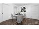 Cozy dining area with a round table and four chairs, located off the kitchen at 304 Gold Hill Ave, Rockwell, NC 28138