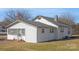 Side view of a white house with a screened porch at 304 Gold Hill Ave, Rockwell, NC 28138