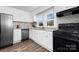 Modern kitchen with white cabinets, granite countertops, and stainless steel appliances at 304 Gold Hill Ave, Rockwell, NC 28138