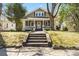 Charming craftsman-style home with a welcoming front porch and well-maintained landscaping at 507 W 2Nd Ave, Gastonia, NC 28052