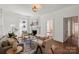 Bright living room with fireplace, hardwood floors, and access to the dining room at 507 W 2Nd Ave, Gastonia, NC 28052