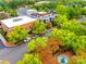 An aerial view of a town center with lush trees and a fountain at 5734 Morris Hunt Dr, Fort Mill, SC 29708