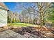 Landscaped backyard with fenced perimeter and patio at 5734 Morris Hunt Dr, Fort Mill, SC 29708