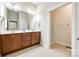 Double vanity bathroom with dark wood cabinets and a glass shower at 5734 Morris Hunt Dr, Fort Mill, SC 29708