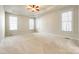 Spacious bedroom with neutral carpeting and large windows at 5734 Morris Hunt Dr, Fort Mill, SC 29708