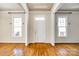 Bright and airy entryway with hardwood floors and tall windows at 5734 Morris Hunt Dr, Fort Mill, SC 29708