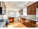 Modern kitchen with granite countertops and wooden cabinetry at 5734 Morris Hunt Dr, Fort Mill, SC 29708