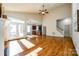 Sunlit living room with hardwood floors, high ceilings, and access to a deck at 5734 Morris Hunt Dr, Fort Mill, SC 29708