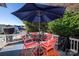 Deck with table, chairs, and umbrella overlooking pool at 625 Circle Trace Rd, Monroe, NC 28110