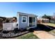 Gray shed with white trim and sliding glass door in backyard at 625 Circle Trace Rd, Monroe, NC 28110