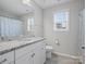 Clean bathroom with granite countertop, white cabinets, and a shower/tub combo at 9507 Inverness Bay Rd, Charlotte, NC 28278