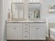 Double vanity bathroom with granite countertops and white cabinets at 9507 Inverness Bay Rd, Charlotte, NC 28278