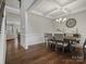 Elegant dining room with hardwood floors and coffered ceiling at 9507 Inverness Bay Rd, Charlotte, NC 28278