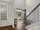 Bright and spacious entryway with hardwood floors and staircase at 9507 Inverness Bay Rd, Charlotte, NC 28278