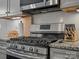 Stainless steel gas cooktop with granite countertop at 9507 Inverness Bay Rd, Charlotte, NC 28278