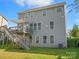 Two-story house with gray siding, deck, and stairs at 9507 Inverness Bay Rd, Charlotte, NC 28278