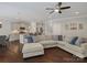 Open living room with large sectional sofa and hardwood floors at 9507 Inverness Bay Rd, Charlotte, NC 28278