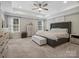 Spacious main bedroom with large bed and ample natural light at 9507 Inverness Bay Rd, Charlotte, NC 28278