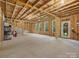 Unfinished basement with open space, windows, and potential for customization at 9507 Inverness Bay Rd, Charlotte, NC 28278