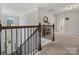 Upper level hallway with staircase and laundry access at 9507 Inverness Bay Rd, Charlotte, NC 28278