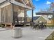 Rear exterior featuring a patio, fire pit, screened in porch, and spacious yard at 111 Alberta Ave, Belmont, NC 28012