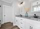 Modern bathroom featuring double vanities, granite countertops, hardwood floors and updated lighting at 111 Alberta Ave, Belmont, NC 28012