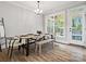 Dining room with rustic table and benches, perfect for Gathering gatherings and entertaining guests at 111 Alberta Ave, Belmont, NC 28012