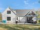 Rear exterior of home showing back patio, screened porch, and spacious backyard at 111 Alberta Ave, Belmont, NC 28012