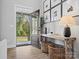 Bright foyer featuring hardwood floors, a stylish bench, and decorative baskets at 111 Alberta Ave, Belmont, NC 28012