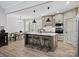 Spacious kitchen features a large island with seating and modern stainless steel appliances at 111 Alberta Ave, Belmont, NC 28012