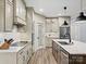 Bright kitchen featuring stainless steel appliances, shaker cabinets, granite countertops, and hardwood floors at 111 Alberta Ave, Belmont, NC 28012