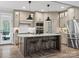 Open kitchen featuring gray cabinets, granite countertops, stainless steel appliances, and large island at 111 Alberta Ave, Belmont, NC 28012