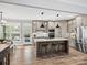 Bright, open kitchen with a large island, stainless steel appliances, and stylish cabinets at 111 Alberta Ave, Belmont, NC 28012