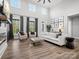 Bright and airy living room with fireplace, comfortable seating, and large windows at 111 Alberta Ave, Belmont, NC 28012