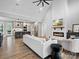 Open-concept living room with fireplace, kitchen, and plenty of natural light at 111 Alberta Ave, Belmont, NC 28012