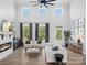 Spacious living room with high ceilings, fireplace, and abundant natural light at 111 Alberta Ave, Belmont, NC 28012