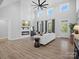 Expansive living room with soaring ceilings, fireplace, and stylish decor at 111 Alberta Ave, Belmont, NC 28012